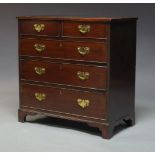 A George III mahogany chest of drawers, with later elements, with two short over three long