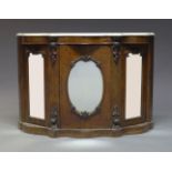 A Victorian walnut and mirrored credenza, surmount with white serpentine marble top, above three