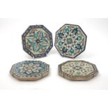 Four Persian Iznic style octagonal tiles, 19th century, each decorated with geometric flowers, 15.