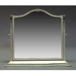 A large white painted dressing table mirror, 20th Century, the top with serpentine outline, raised