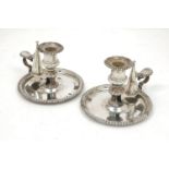 A pair of Georgian silver chamber sticks, Sheffield, c.1824, John and Thomas Settle, the circular