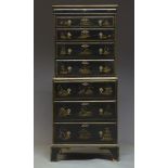 A Chinoiserie black lacquered chest on chest, late 19th, early 20th Century, overall decorated