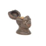 A treen inkwell, 19th century, in the form of an African man's head, 11cm high, together with a