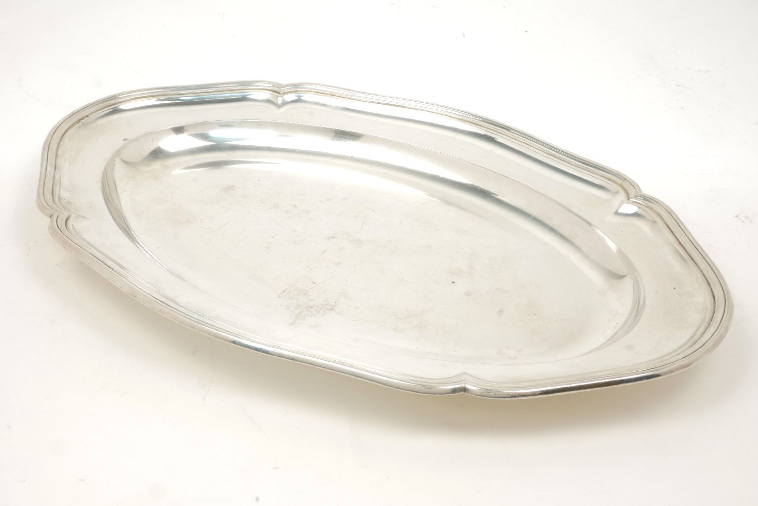 A large oval Swedish silver serving dish, c.1917, K. Anderson, the flat base rising to a stepped,