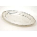 A large oval Swedish silver serving dish, c.1917, K. Anderson, the flat base rising to a stepped,