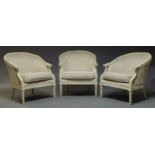 A set of three white painted and upholstered bergere armchairs, late 20th Century, with simulated