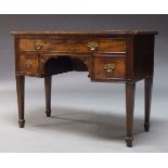 A mahogany bow front serving table, 19th Century, with one long and two short drawers, raised on