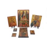 A miniature icon of Mary, Mother of God, with a silver oklad, 9 x 6cm together with six other icons,