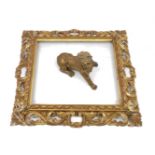 A carved giltwood rectangular frame, 19th century, 48cm x 53cm and an 18th century carved wood lion,