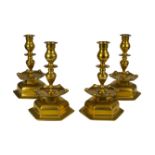 A set of four brass candlesticks, probably Flemish, 18th century, 24cm high (4)180