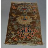 Two Chinese rugs, with brown fields, together with a pictorial panel (3)150