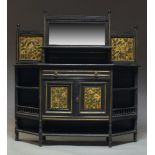 An Aesthetic movement ebonised and parcel gilt side cabinet with four gilt floral decorated