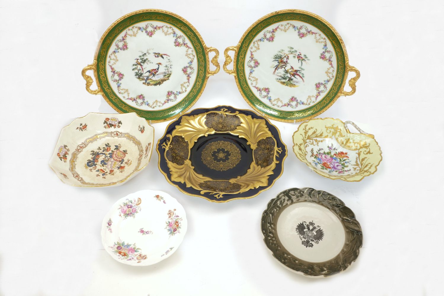 A French porcelain gilt mounted Limoges tazza, together with a similar gilt metal mounted dish and a