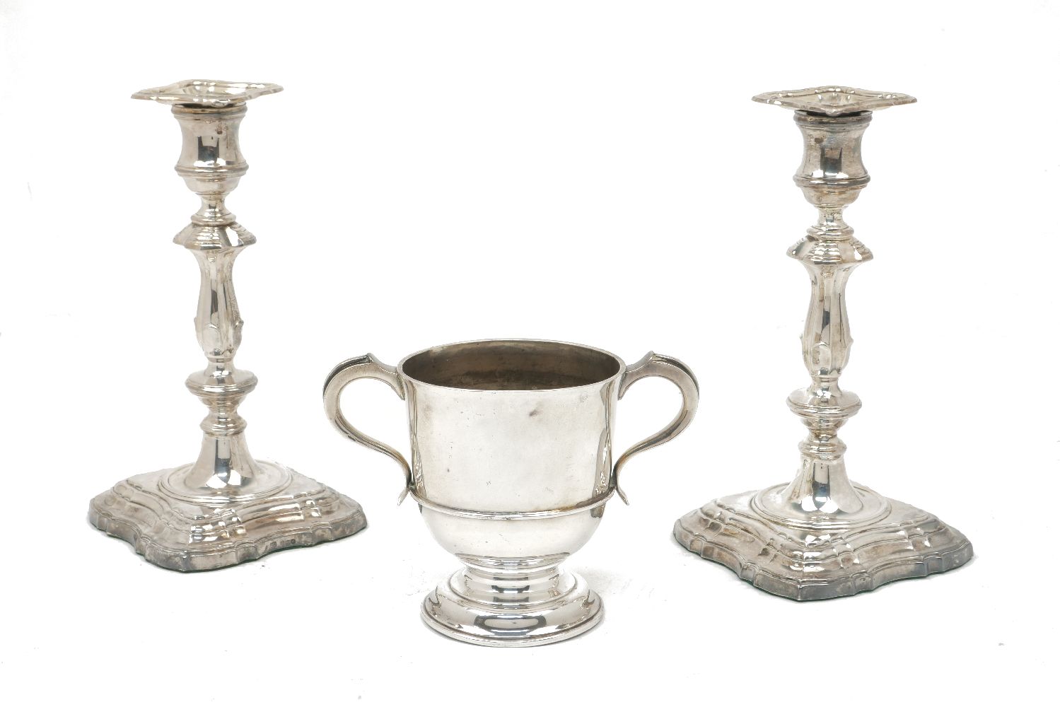 A pair of silver baluster candlesticks, Sheffield, c.1964, CJ Vander, together with a two-handled