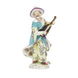 A German porcelain figure of a man playing a mandolin, in the Meissen style, late 19th century, he