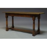 A small oak refectory table, mid 20th Century, with two plank top, on turned tapering supports