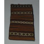 Four Turkmen rectangular tent bags, a small Turkmen rug, and another small rug (6)80