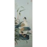 A large Chinese silk embroidered picture depicting two ducks in a landscape, framed, 72cm x 28cm,