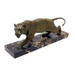 An Art Deco bronze tiger on marble base, c.1930's, crouching full length, 51cm wide.150