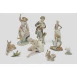 A Lladro porcelain figure of a girl with her dog, printed and impressed mark to base, 29cm high,