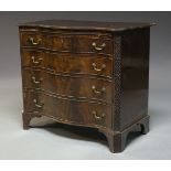 A George III style mahogany serpentine fronted chest of four long graduated drawers, late 19th