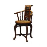 A Chinese occasional chair, late 19th century, the yoke-shape back centered with a carved and