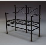 A black painted cast iron garden bench, late 19th, early 20th Century, with rod backrest and