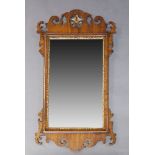 A George II style mahogany and parcel gilt fretwork wall mirror, early 20th Century, the crest
