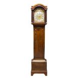 A George III mahogany longcase clock, the arched hood with three brass ball finials and glazed