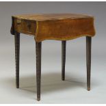 A George III mahogany and crossbanded Pembroke table, with two serpentine drop leaves, above