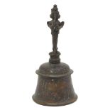 An Indian bronze bell, 20th century, with a figural handle, 20.5cm high70