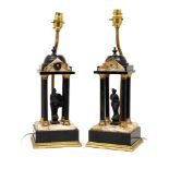 A pair of late Victorian clock garnishes in the form of Neoclassical temples, of gilt metal with