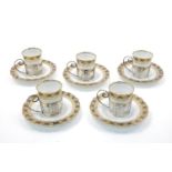 A five-piece Aynsley porcelain coffee set, to comprise coffee cans and saucers, the rims decorated