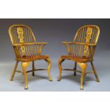A pair of elm and beech Windsor chairs, second half 20th Century, the hooped backs, with shaped