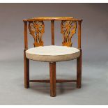 A George III fruitwood corner chair, the curved top rail over pierced splats, flanked by column