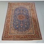 A Isfahan carpet, mid 20th Century, the blue field central medallion and all over entwined flowering