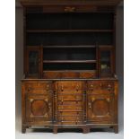 A Victorian oak and inlaid dresser, the plate rack with moulded cornice above three shelves, two