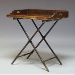 A George III mahogany butler's tray on later stand, the rectangular tray, with raised sides and