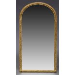 A Victorian gilt wall mirror, of arched form, with rope twist border, 77cm high, 41cm wide60