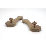 A pair of Islamic Indian hardwood clogs with turned finials to the top, 25cm long (2).60
