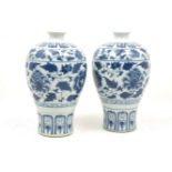 A pair of Chinese porcelain blue and white vases, late 20th century, decorated in the Ming style