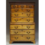 A George III mahogany chest on chest with dentil moulded cornice, above blind-fret carved frieze and