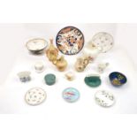A collection of small porcelain receptacles by Royal Worcester with an Imari style plate and a