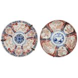 A near pair of large Japanese porcelain imari chargers, late 19th century, each painted with