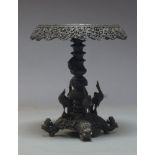 An Anglo Indian hardwood side table, early 20th Century, the circular top with carved and pierced