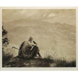 A black and white photograph of a monk looking outward to a landscape, indistinctly signed to