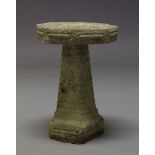 A Composite stone bird bath, late 20th Century, the octagonal top on square tapering column, 60cm