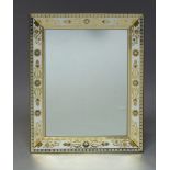 A Continental verre eglomise and brass bound wall mirror, second half 20th Century, of rectangular