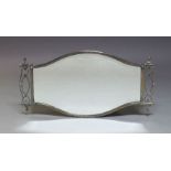A silver plated wall mirror, first half 20th Century, the shaped frame, with beveled plate,