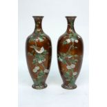 A pair of Japanese enamel vases, late 19th/early 20th century, decorated with peach trees and